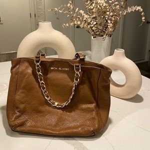 Michael Kors bag with gold chain and hardware.